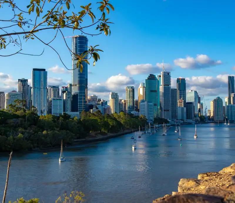 The Brisbane CBD skyline above a bend in the Brisbane River